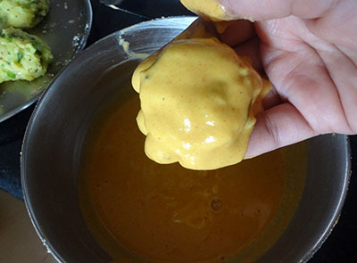 potatoes coated with batter for aloo or alugadde bonda