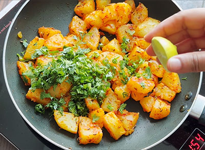 coriander leaves and lemon juice for aloo jeera or potato fry recipe