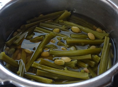 cooking avarekalu and stem for avarekalu basale soppu sambar