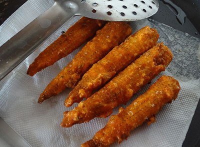 deep frying the baby corns for baby corn golden fry