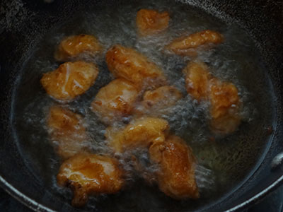 sliced baby corns in the batter for baby corn manchurian