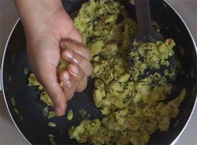 making banana balls for balekai snacks or raw banana balls