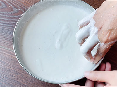 mixing the batter for banale dose or kadai dosa or bun dosa