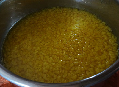 rinse and cook green gram dal for hesaru bele bili saaru or mung dal tomato rasam