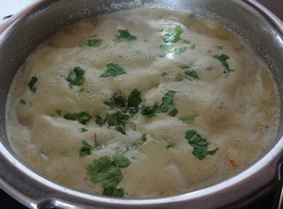 boiling hesaru bele bili saaru or mung dal tomato rasam