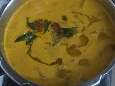 tempering kumbalakai huli or ash gourd sambar