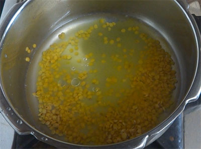 cooking dal for kumbalakai huli or ash gourd sambar