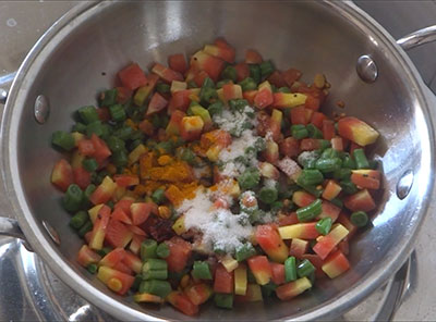 Chopped snake gourd for carrot beans palya recipe