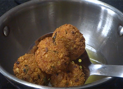 deep frying masala vada or masala vade or chattambade or ambode