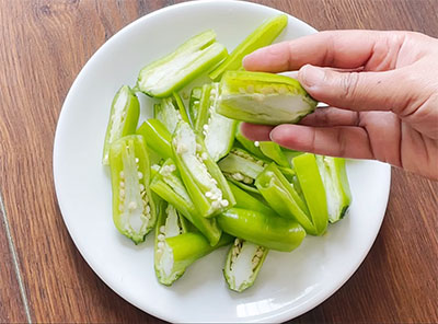 chopping chillies for chilli bajji or menasinakayi bajji