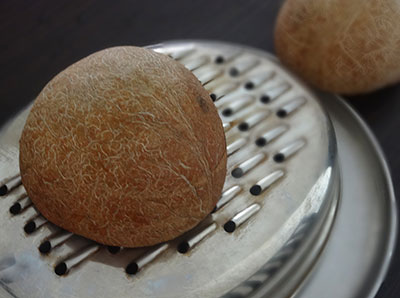 grating dry coconut for coconut garlic chutney powder