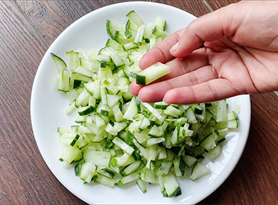 chopping cucumber for southekayi mosaru palya or cucumber raita recipe