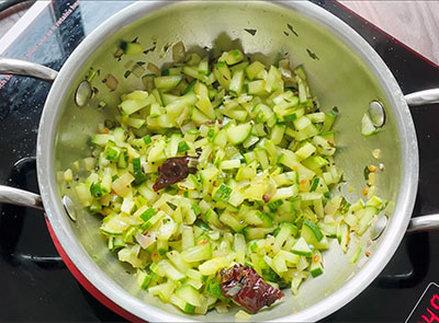 frying cucumber pieces for southekayi mosaru palya or cucumber raita recipe