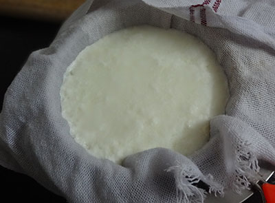 straining the curd to get hung curd for curd sandwich