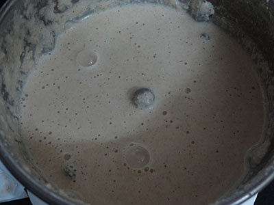 grinding coconut, poppy seeds and rice for gasagase payasa or kheer