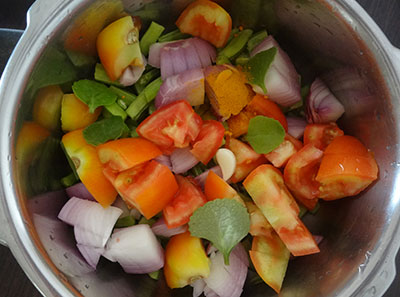 chopped cluster beans, onion and tomato for gorikayi kara or cluster beans curry