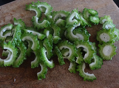 sliced bittergourd for hagalakai pakoda or bittergourd chips or karela fry