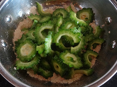 bittergourd and flour for hagalakai pakoda or bittergourd chips or karela fry