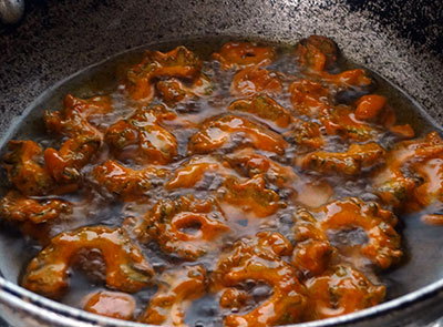 frying hagalakai pakoda or bittergourd chips or karela fry