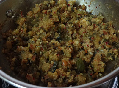 making hagalakayi palya or bitter gourd stir fry