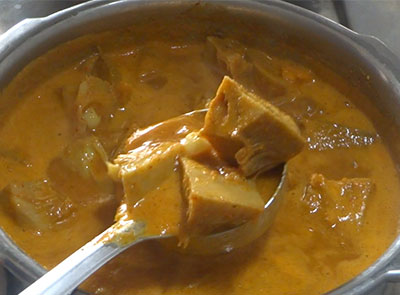 boiling halasinakayi huli or raw jackfruit sambar