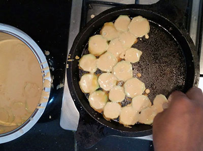 placing ridge gourd slices for ridge gourd dosa or heerekai dose