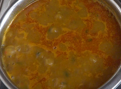 boiling hesaru kalu saaru or sprouts sambar