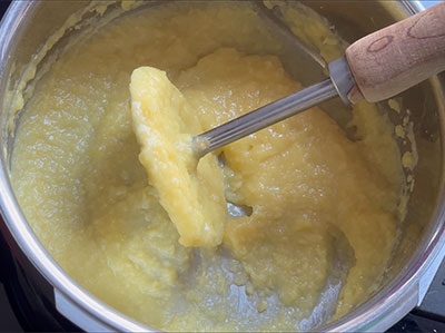 mashing the cooked dal for hesaru bele chakli or moong dal murukku recipe