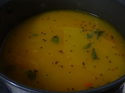 grinding coconut and spices for hunase thokku saaru or rasam