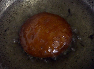 deep frying athrasa or kajjaya