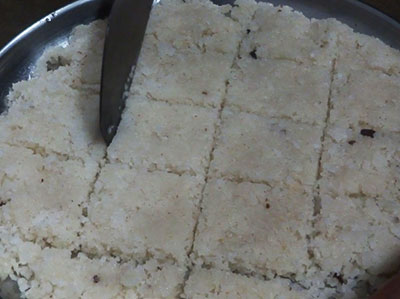 cutting kayi burfi or coconut burfi