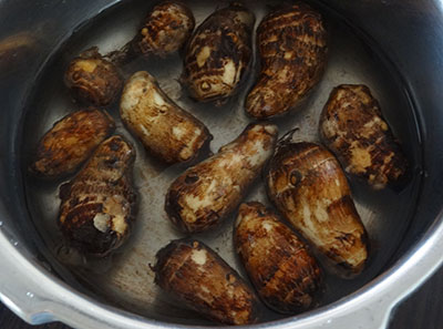 cooking colocasia root for kesuvina gadde palya or arbi stir fry