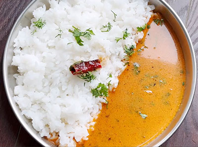 serving kobbari saaru or coconut rasam