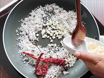 garlic for kobbari saaru or coconut rasam