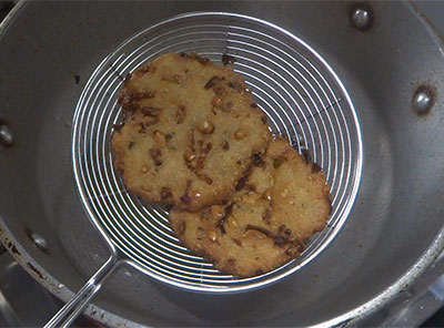 frying crispy maddur vada