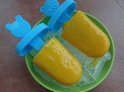 hold the freezed popsicles under running water