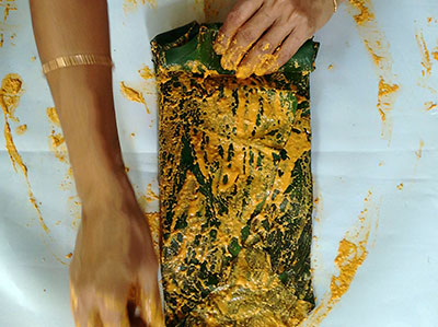 rolling the colocasia leaves for pathrode