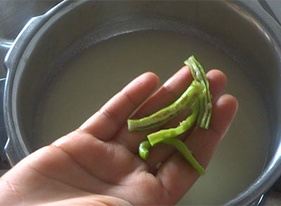 mashing potato for potato rasam or alugadde saaru