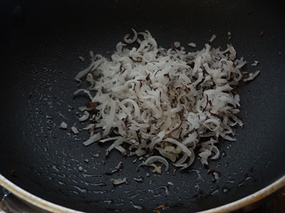 roasting coconut for Karnataka style puliyogare or tamarind rice