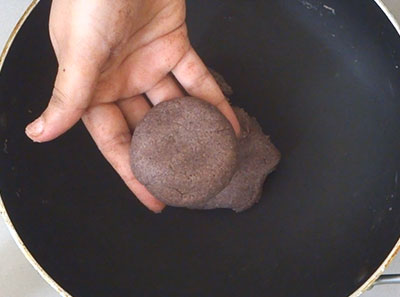 mixing the flour for ragi rotti or ragi chapathi