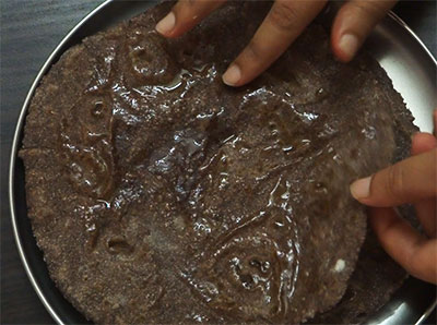 cooking ragi rotti or ragi chapathi