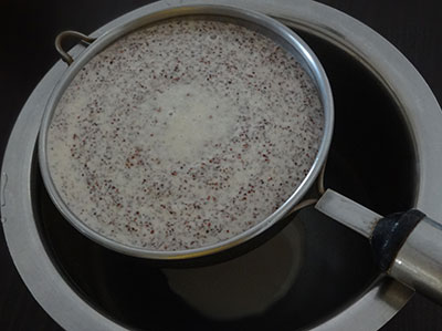 filtering the batter for ragi halbai or halubai