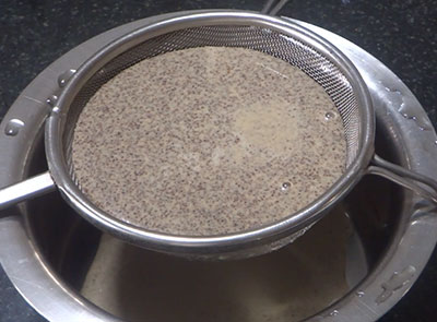 grind sesame seeds and jaggery for ragi milk or halu or milkshake or juice