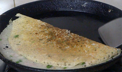 rava onion dosa or rava onion dose on iron pan