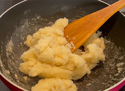 mixing the dough for rave rotti or plain rava roti recipe