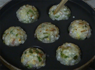 cook sabakki paddu or sabudana paniyaram on both sides