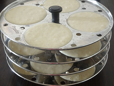 pour the batter in idli moulds for siridhanya idli or millets idli