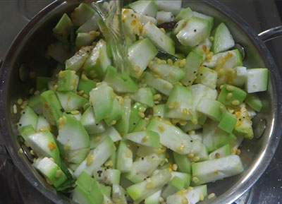 cooking sorekai palya or bottle gourd stir fry