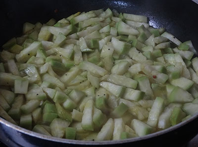 cooking sorekai palya or bottle gourd stir fry