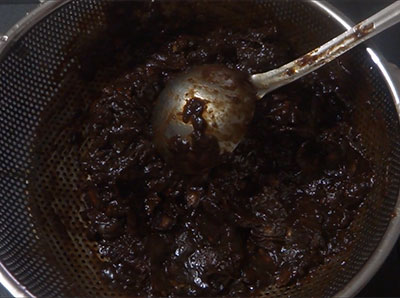 straining the tamarind pulp for home made tamarind paste recipe